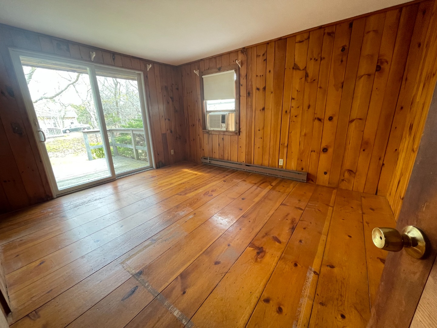 42 Marthas Road Edgartown, MA 02539 - Photo 14 of 18 a view of an empty room with wooden floor and a window