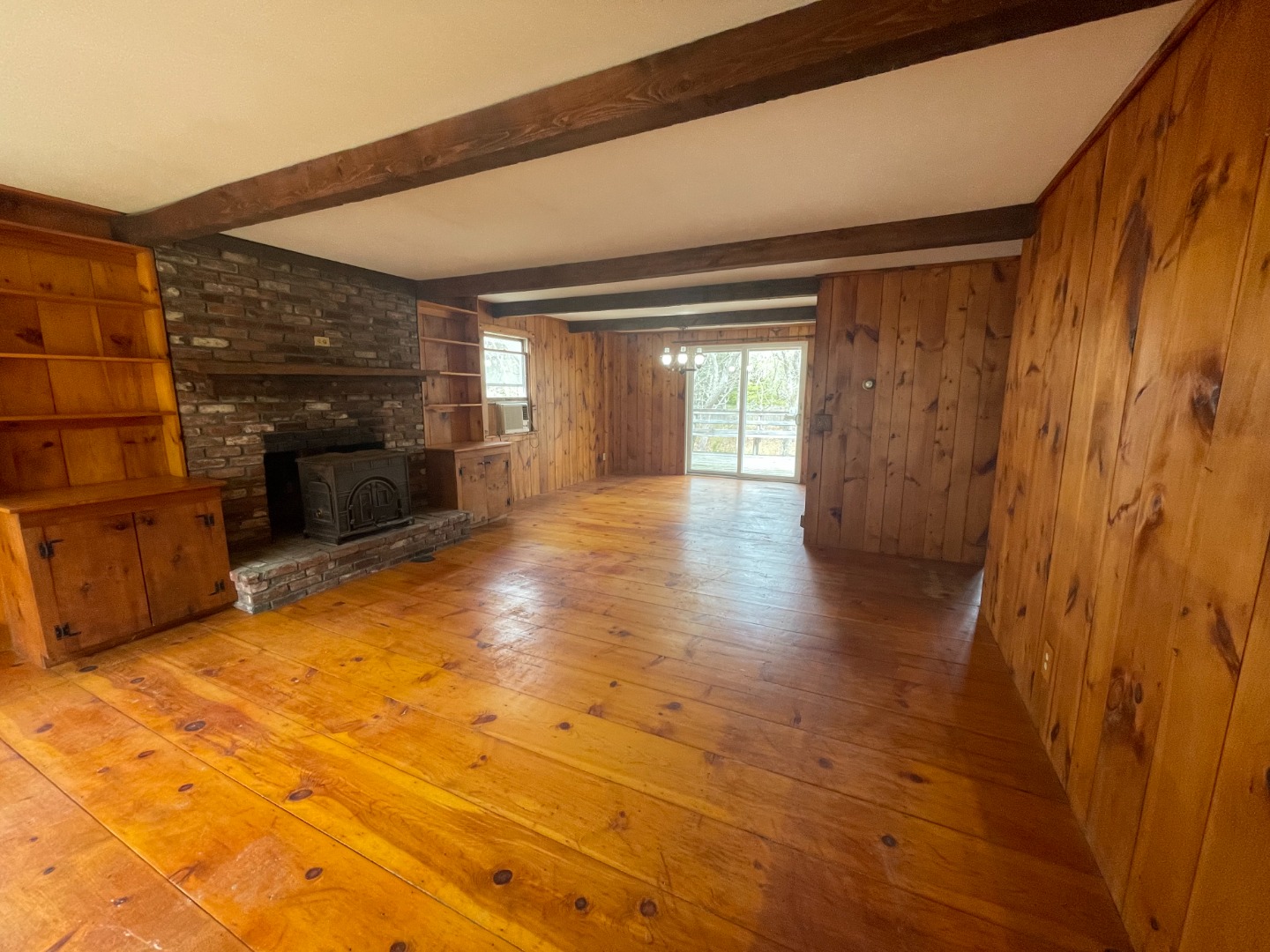 42 Marthas Road Edgartown, MA 02539 - Photo 18 of 18 a view of an empty room with a fireplace and a window