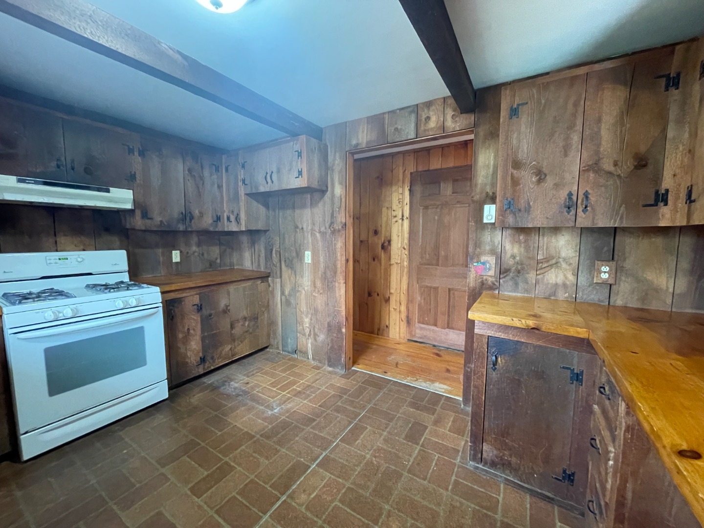 42 Marthas Road Edgartown, MA 02539 - Photo 6 of 18 a kitchen with a sink a stove and cabinets
