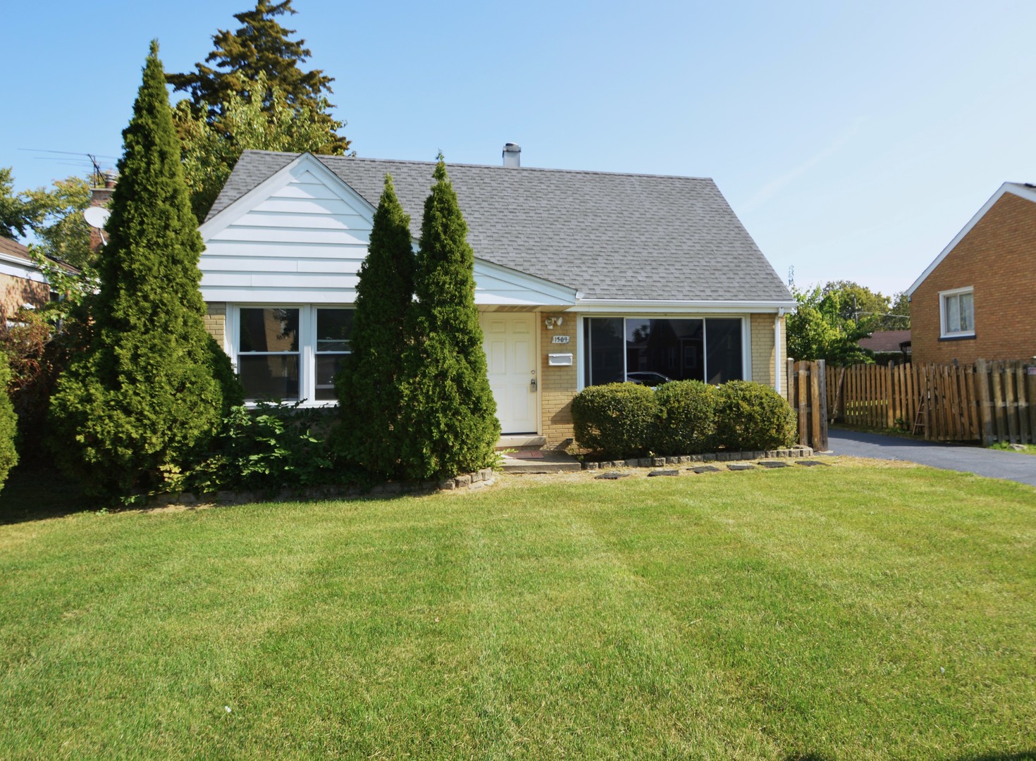 1509 Morris Avenue Berkeley, IL 60163 - Photo 2 of 28 a front view of house with yard and trees