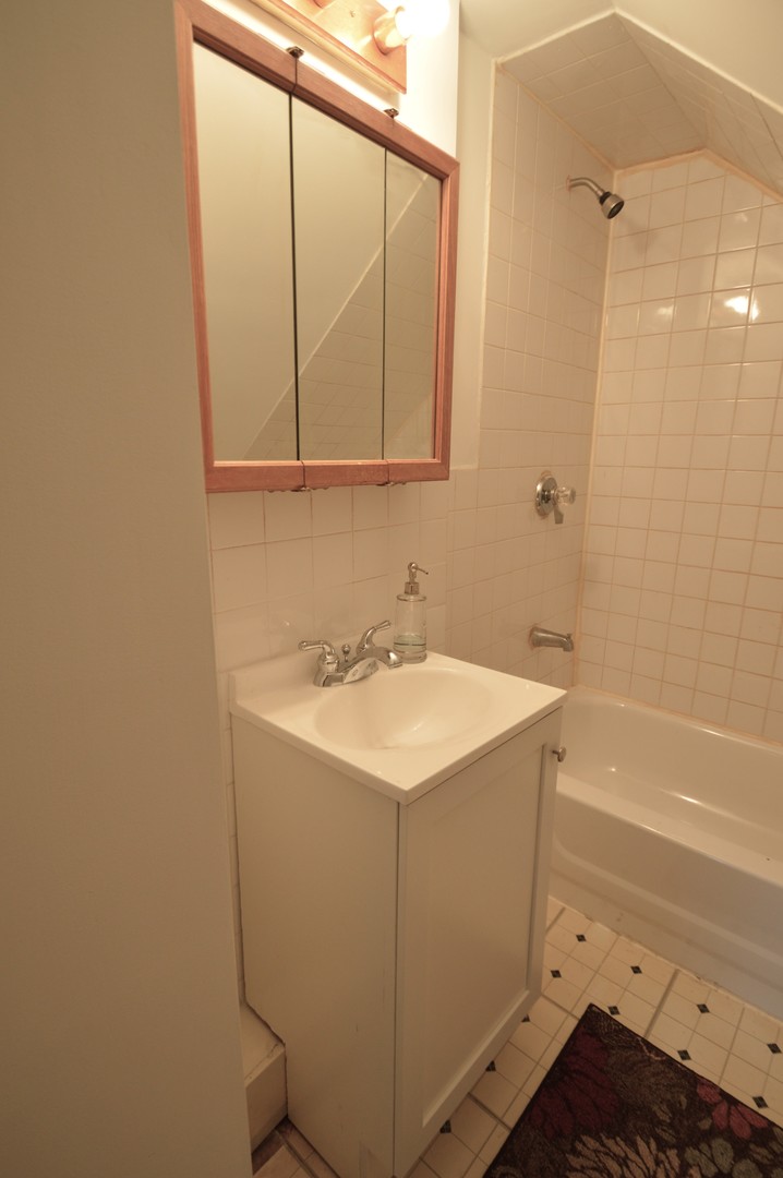 1509 Morris Avenue Berkeley, IL 60163 - Photo 23 of 28 a bathroom with a sink and a mirror