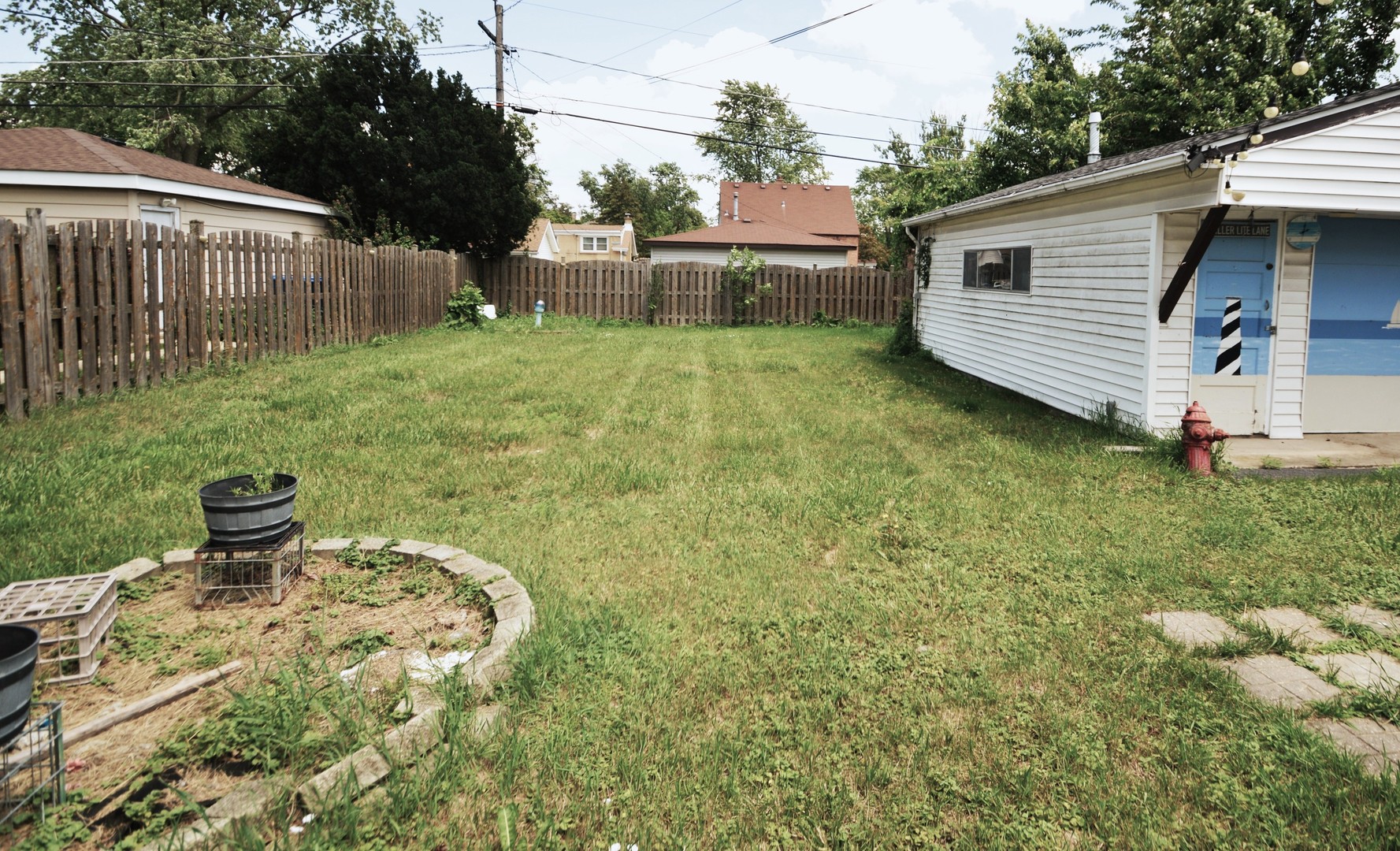 1509 Morris Avenue Berkeley, IL 60163 - Photo 28 of 28 a backyard of a house with table and chairs