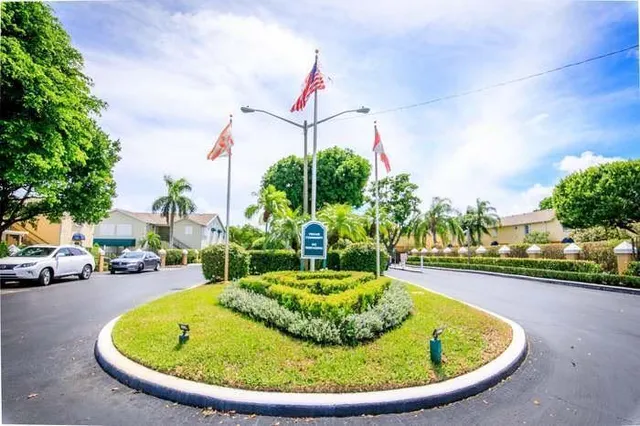 a swimming pool with outdoor seating and yard