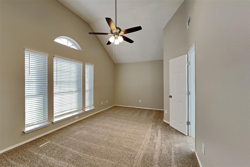 7309 Indiana Avenue Fort Worth, TX 76137 - Photo 7 of 18 Spare room featuring light carpet, high vaulted ceiling, and a ceiling fan