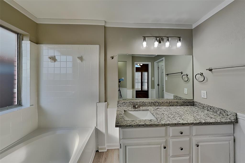 7309 Indiana Avenue Fort Worth, TX 76137 - Photo 9 of 18 Full bath featuring vanity, ornamental molding, and light wood-type flooring