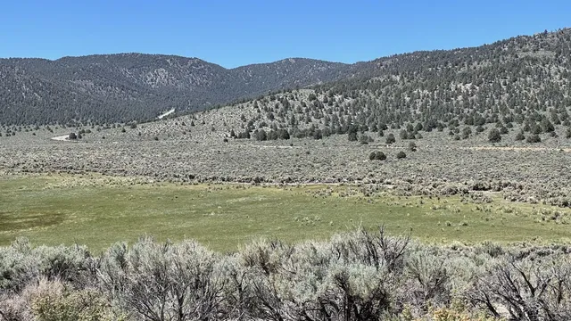 a view of a mountain view with mountains in the background
