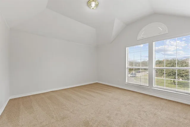 a spacious bathroom with a double vanity sink a large mirror and a bathtub with shower