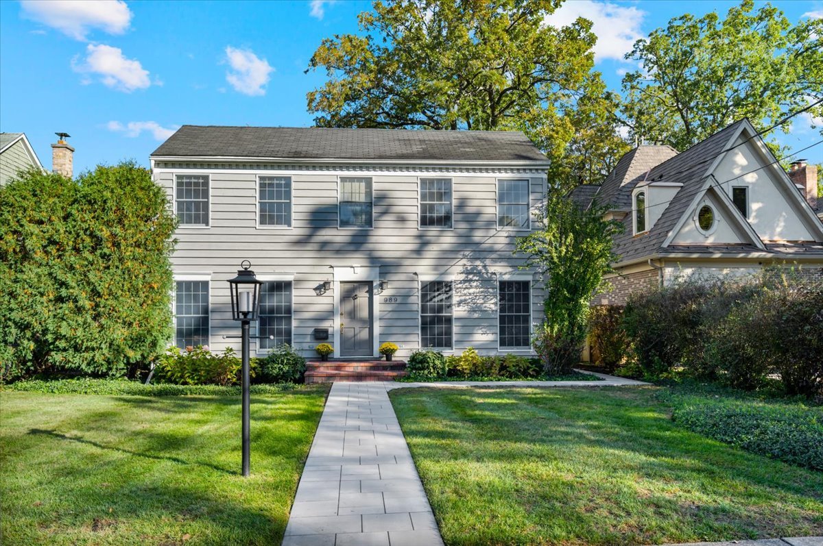 989 Ash Street Winnetka, IL 60093 - Photo 1 of 35 a front view of house with yard and green space