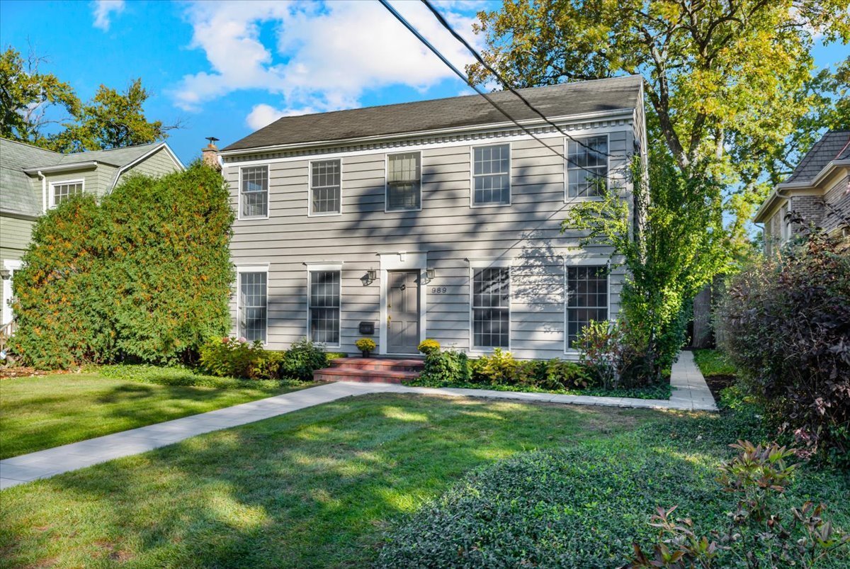 989 Ash Street Winnetka, IL 60093 - Photo 2 of 35 a view of a big building with big yard and large trees