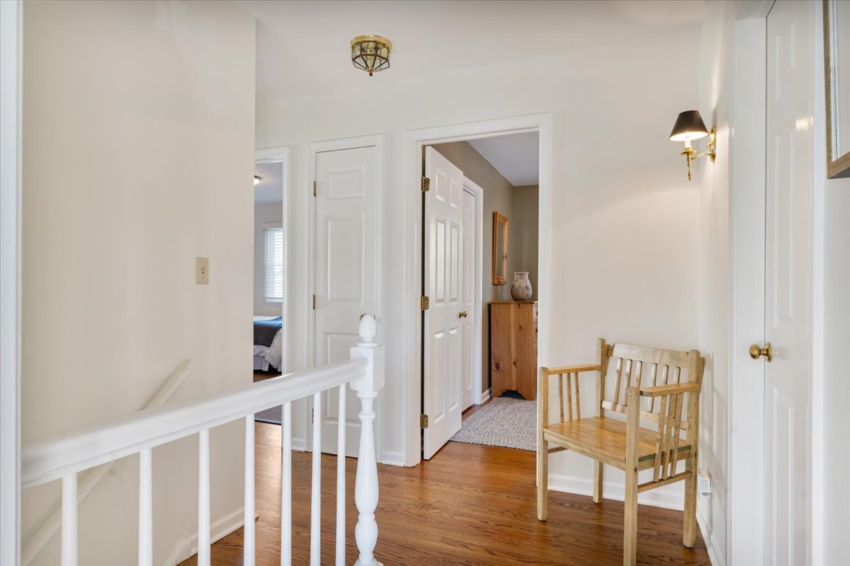 989 Ash Street Winnetka, IL 60093 - Photo 21 of 35 a view of a hallway with wooden floor and glass door
