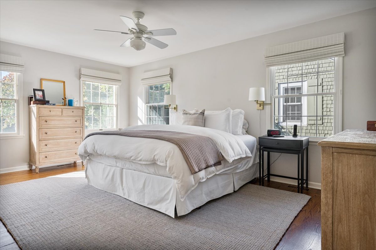 989 Ash Street Winnetka, IL 60093 - Photo 23 of 35 a bedroom with a bed and a dresser next to a window