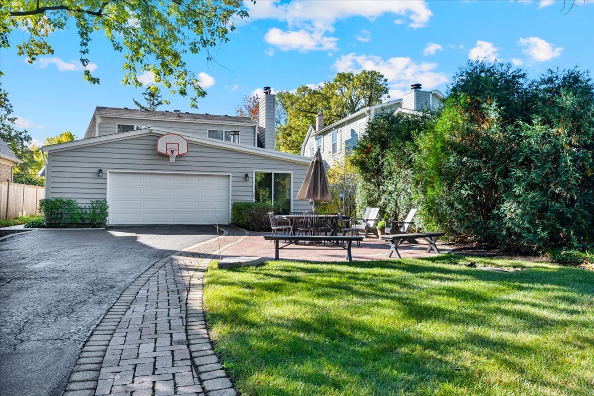 989 Ash Street Winnetka, IL 60093 - Photo 28 of 35 a view of a house with a yard and sitting area