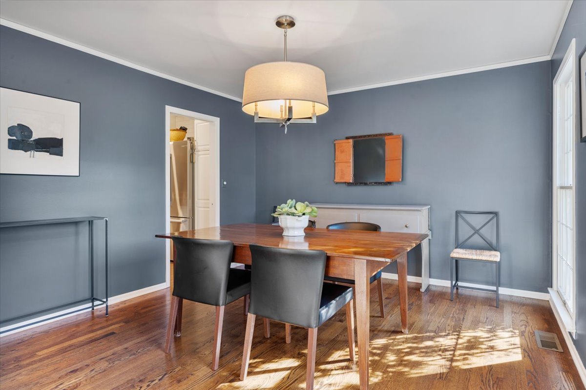 989 Ash Street Winnetka, IL 60093 - Photo 9 of 35 a dining room with furniture and wooden floor