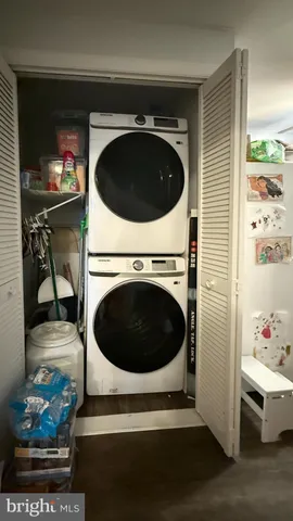 a kitchen with white cabinets and sink