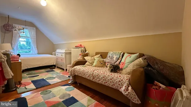 a bed room with a bed and a couch