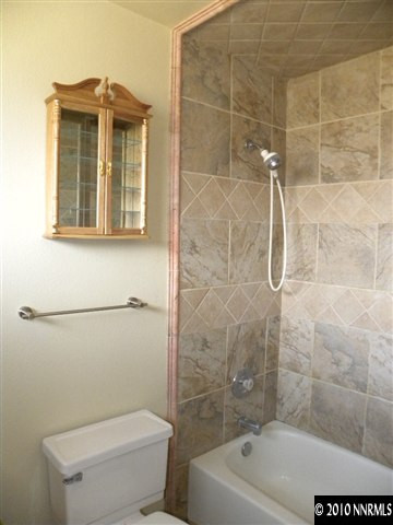 3835 Peregrine Circle Reno, NV 89508 - Photo 8 of 9 a bathroom with a toilet and shower