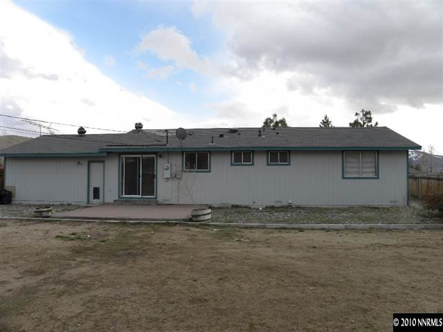 3835 Peregrine Circle Reno, NV 89508 - Photo 9 of 9 a view of a house with a wooden fence