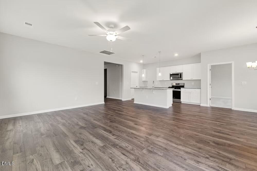 460 Hallingsfield Way Zebulon, NC 27597 - Photo 15 of 31 a view of kitchen with granite countertop cabinets and refrigerator