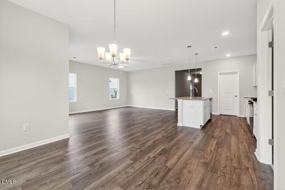 460 Hallingsfield Way Zebulon, NC 27597 - Photo 17 of 31 a view of a kitchen with sink and wooden floor