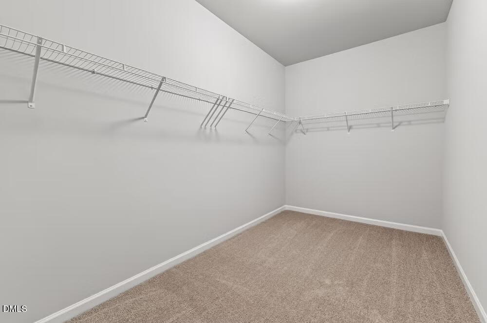 460 Hallingsfield Way Zebulon, NC 27597 - Photo 19 of 31 a view of a room with racks on the wall