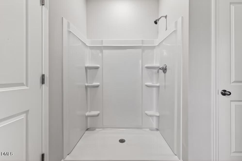 460 Hallingsfield Way Zebulon, NC 27597 - Photo 21 of 31 a bathroom with a shower