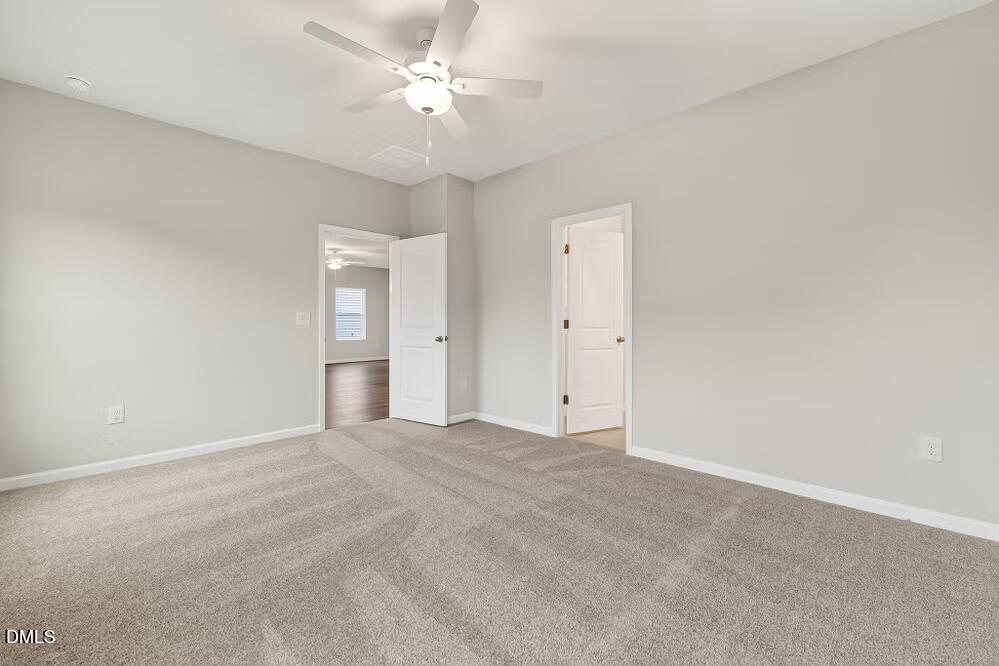 460 Hallingsfield Way Zebulon, NC 27597 - Photo 22 of 31 a view of an empty room with a ceiling fan