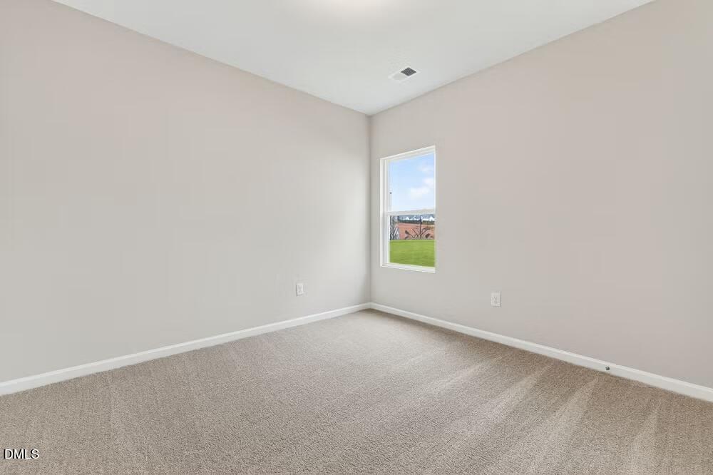 460 Hallingsfield Way Zebulon, NC 27597 - Photo 26 of 31 a view of an empty room with a window