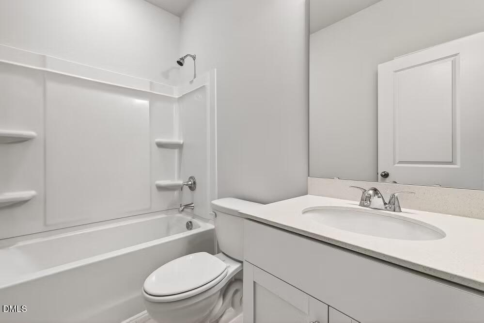 460 Hallingsfield Way Zebulon, NC 27597 - Photo 27 of 31 a bathroom with a sink a toilet and shower
