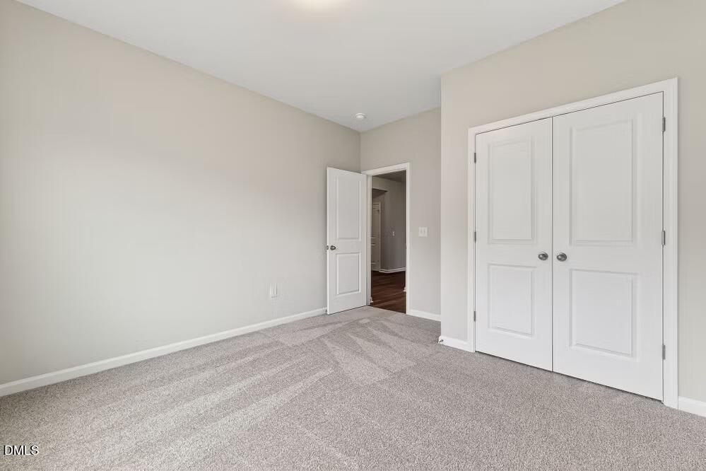 460 Hallingsfield Way Zebulon, NC 27597 - Photo 28 of 31 a view of an empty room and closet area