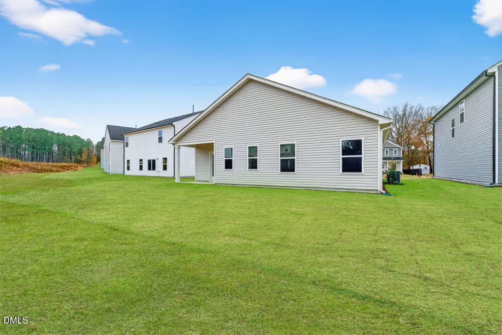 460 Hallingsfield Way Zebulon, NC 27597 - Photo 4 of 31 a view of a house with a big yard