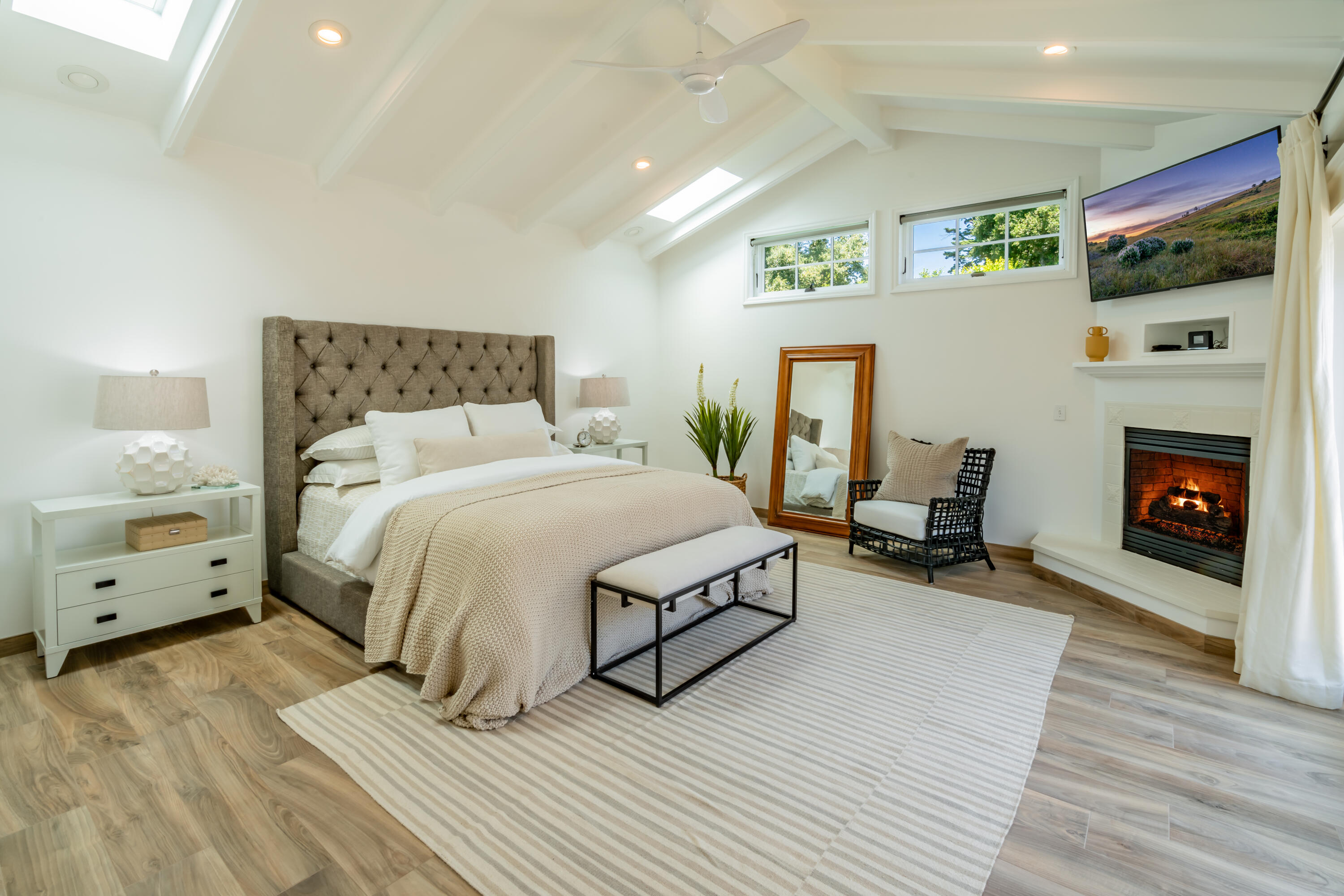 1180 High Road Montecito, CA 93108 - Photo 11 of 39 a spacious bedroom with a bed and a fireplace