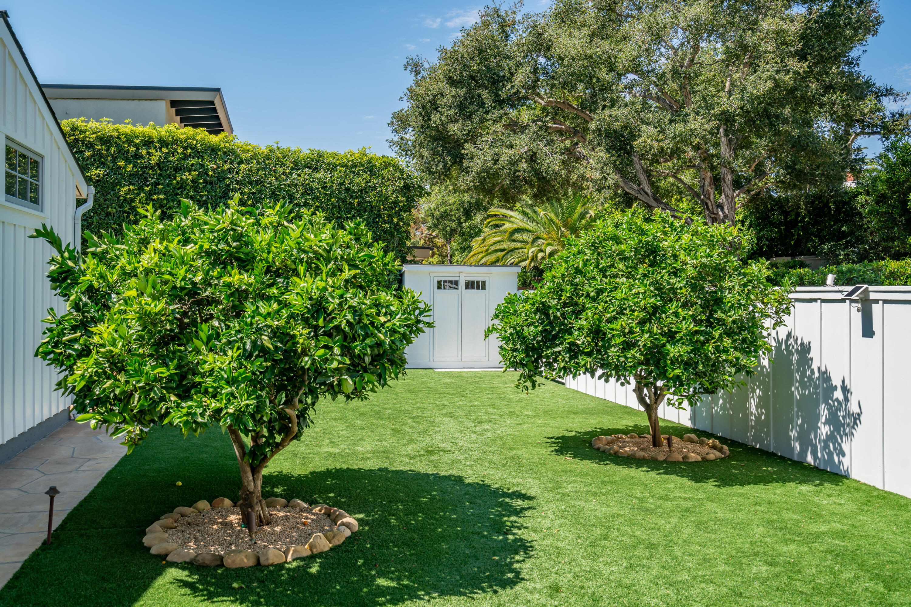 1180 High Road Montecito, CA 93108 - Photo 19 of 39 a view of a garden with a fountain