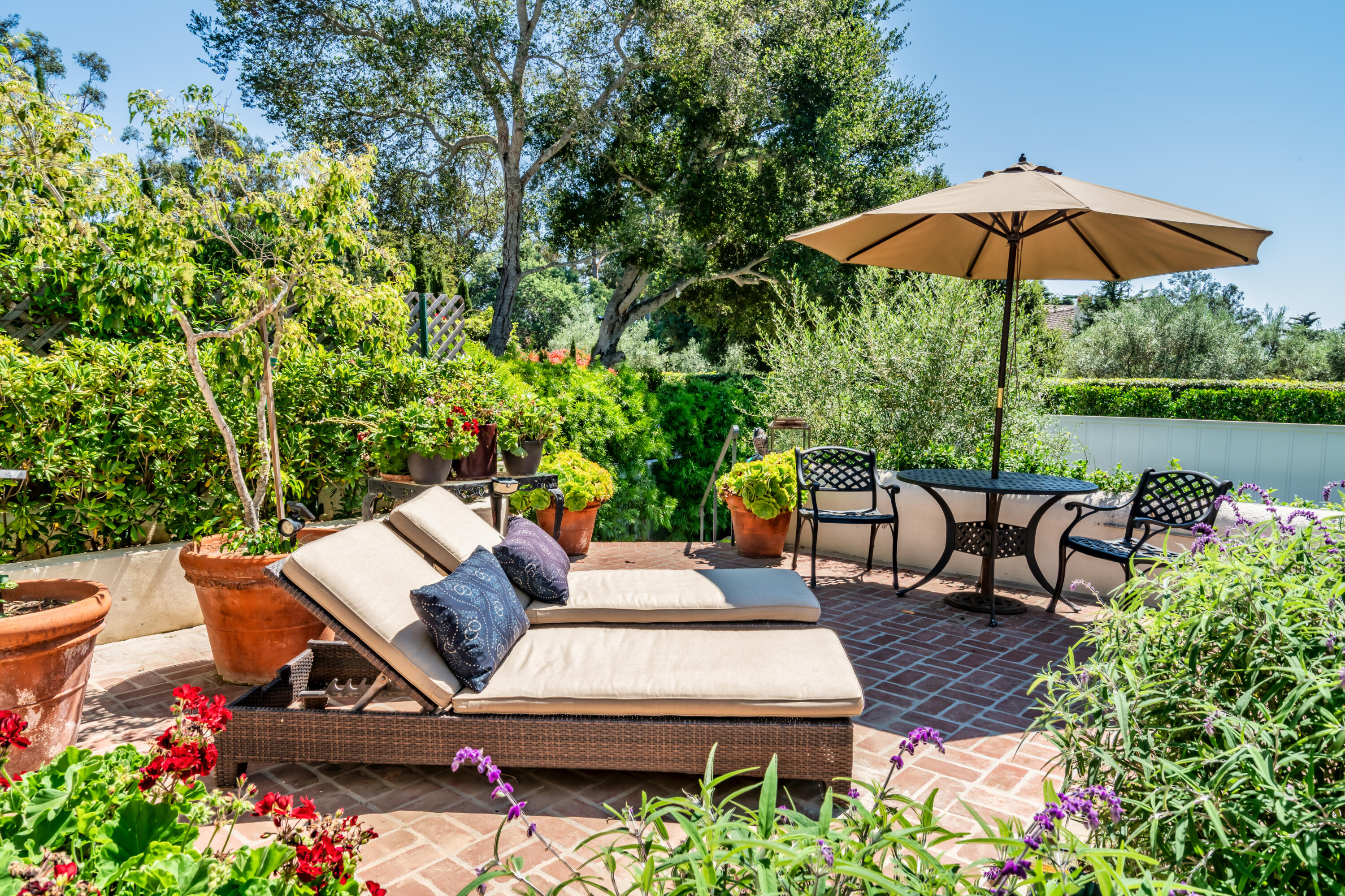 1180 High Road Montecito, CA 93108 - Photo 20 of 39 a view of a backyard with sitting area and furniture