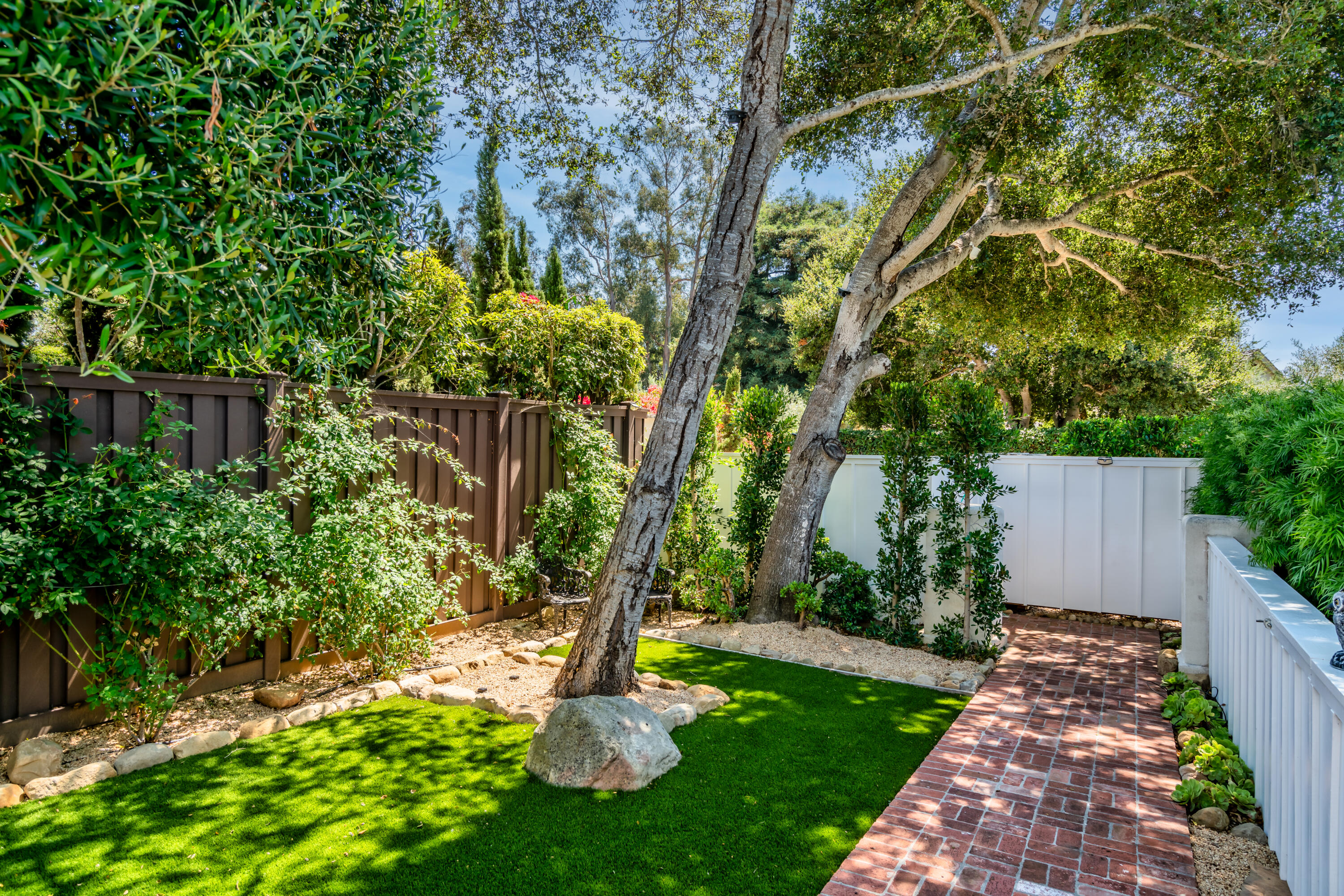 1180 High Road Montecito, CA 93108 - Photo 24 of 39 a backyard of a house with lots of green space