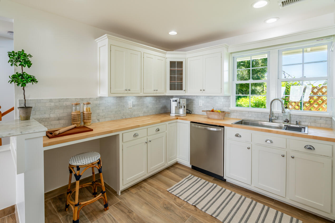 1180 High Road Montecito, CA 93108 - Photo 29 of 39 a kitchen with a sink window and cabinets