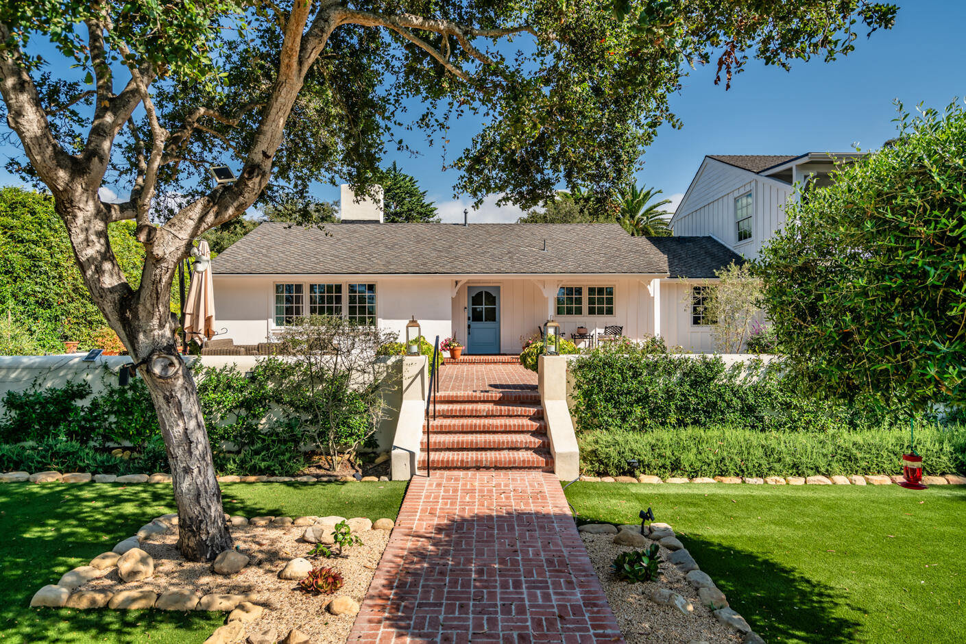 1180 High Road Montecito, CA 93108 - Photo 3 of 39 a front view of a house with a yard