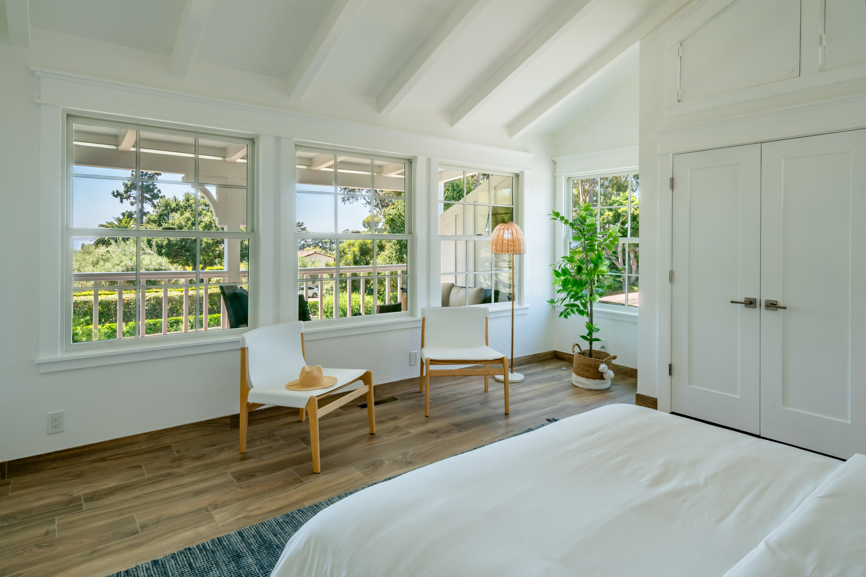 1180 High Road Montecito, CA 93108 - Photo 33 of 39 a living room with hardwood floor and a table