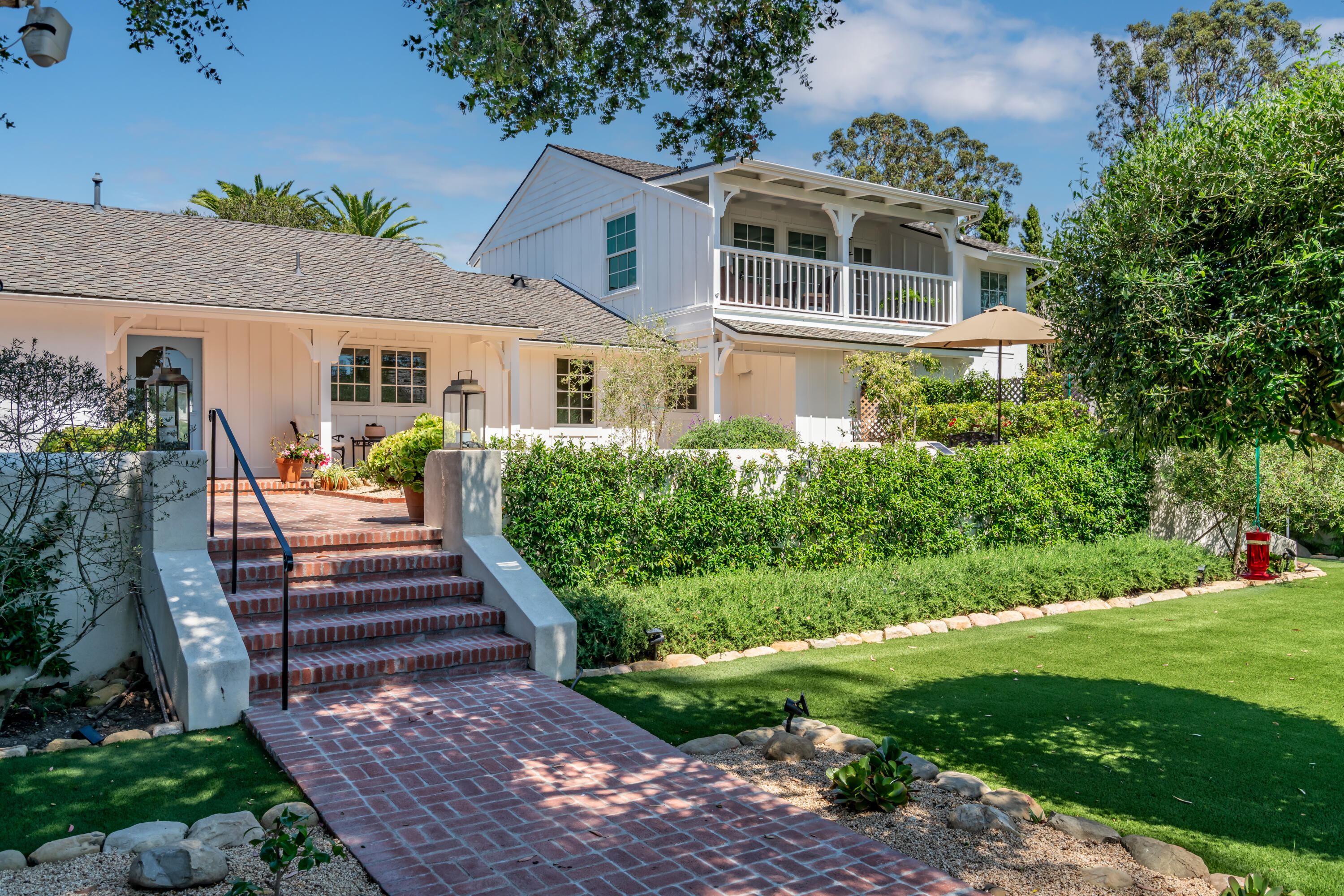 1180 High Road Montecito, CA 93108 - Photo 5 of 39 a front view of a house with a yard