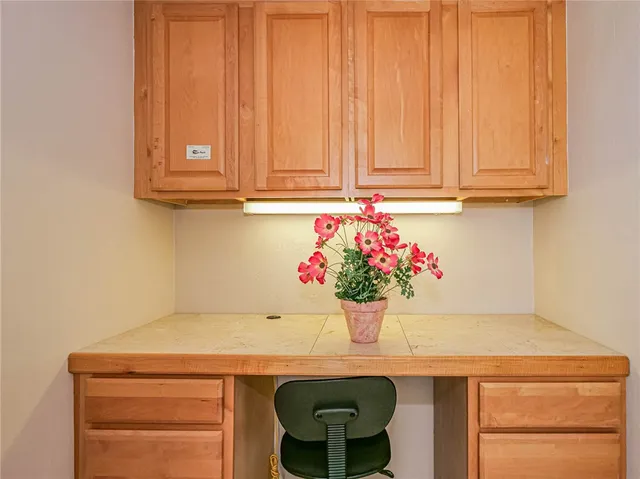 a room with a sink and cabinets