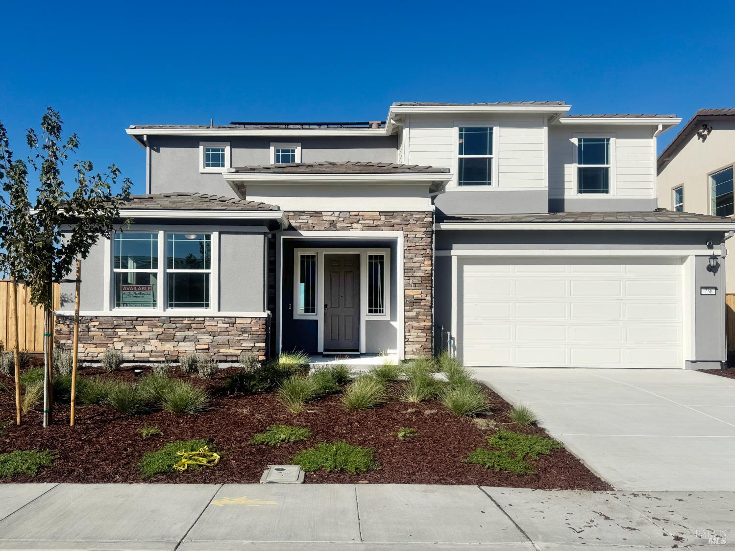 front view of a house with a small yard