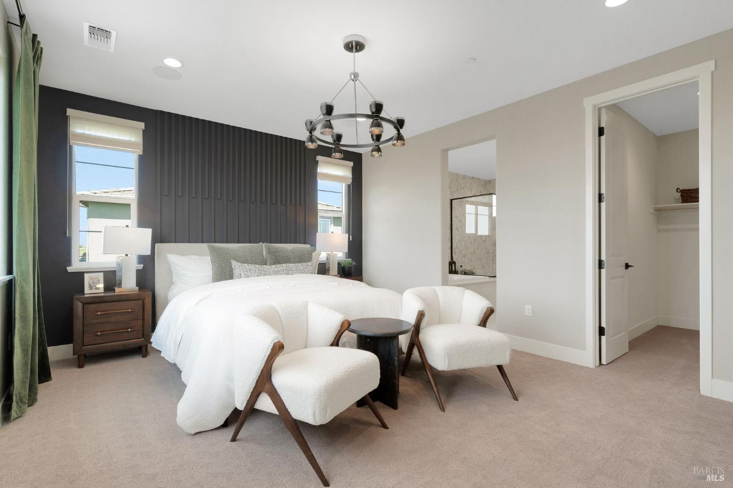 736 Temescal Street Antioch, CA 94561 - Photo 21 of 39 a bedroom with a bed and a chandelier