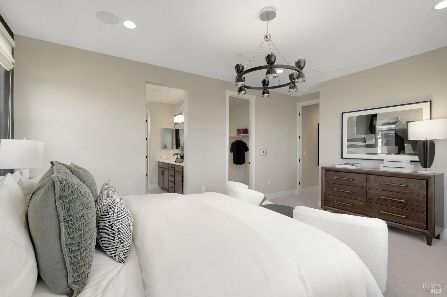 736 Temescal Street Antioch, CA 94561 - Photo 22 of 39 a bedroom with a bed and a chandelier