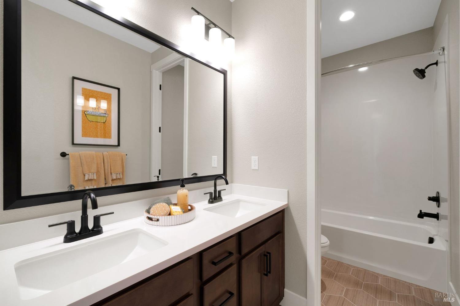 736 Temescal Street Antioch, CA 94561 - Photo 33 of 39 a bathroom with a sink and a mirror