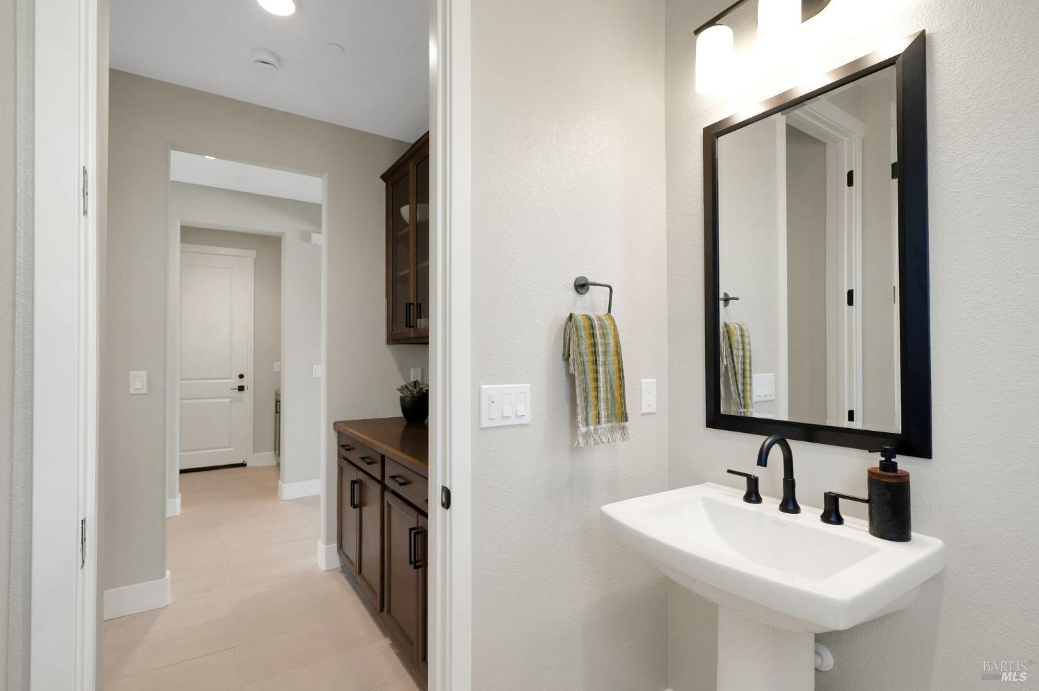 736 Temescal Street Antioch, CA 94561 - Photo 37 of 39 a bathroom with a sink and a mirror