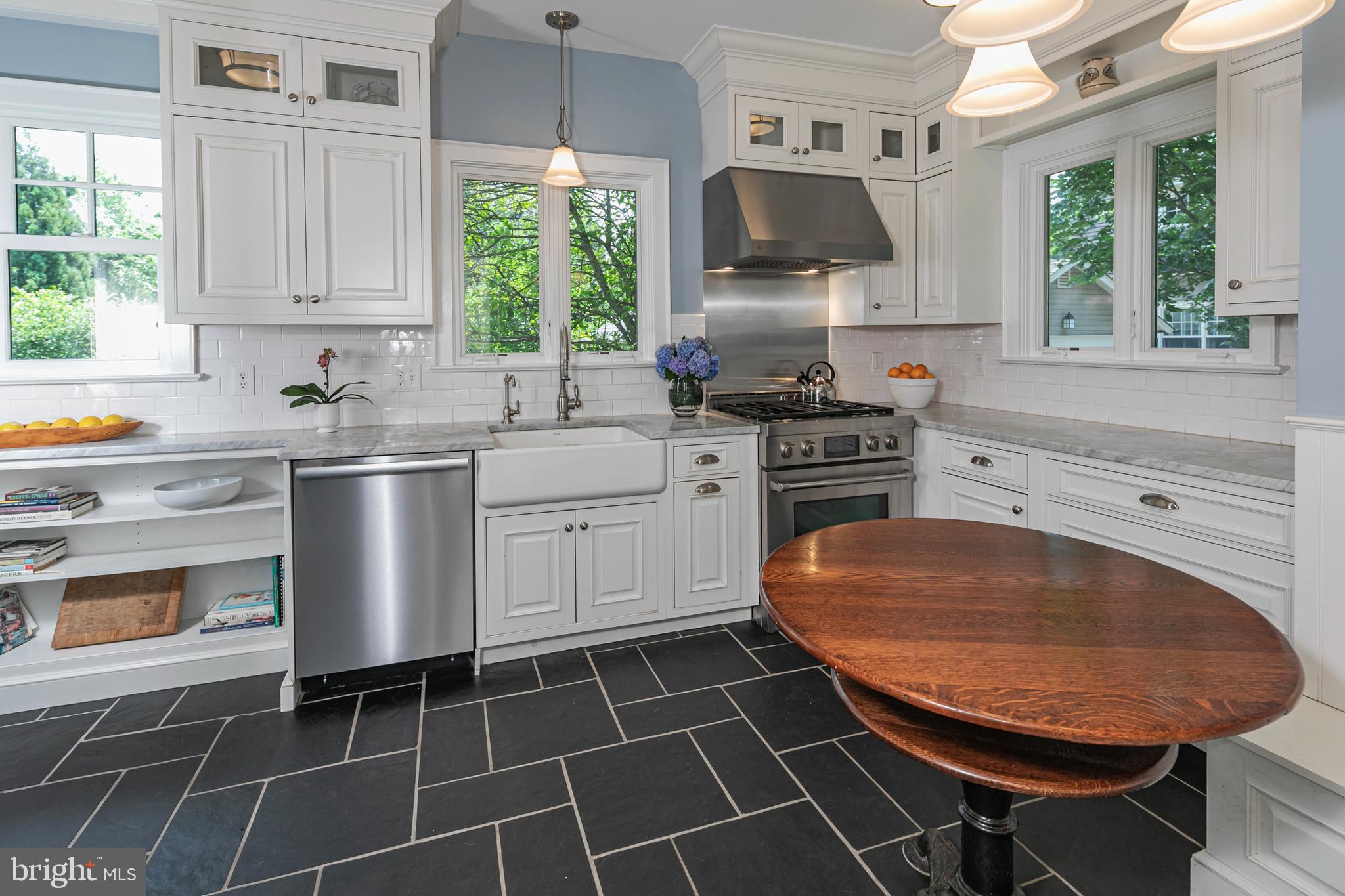 8 Ober Road Princeton, NJ 08540 - Photo 12 of 34 a kitchen with stainless steel appliances a stove a sink and a microwave