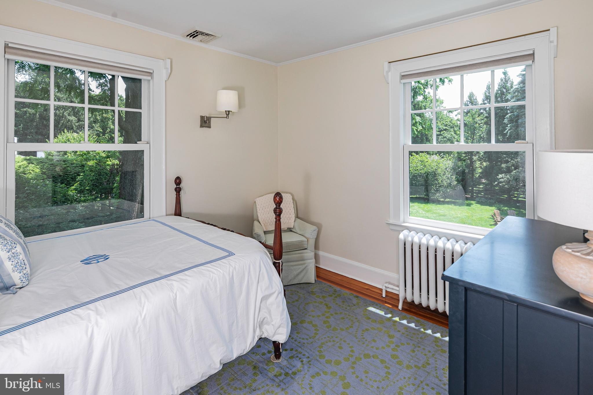 8 Ober Road Princeton, NJ 08540 - Photo 16 of 34 a bedroom with a bed and a table