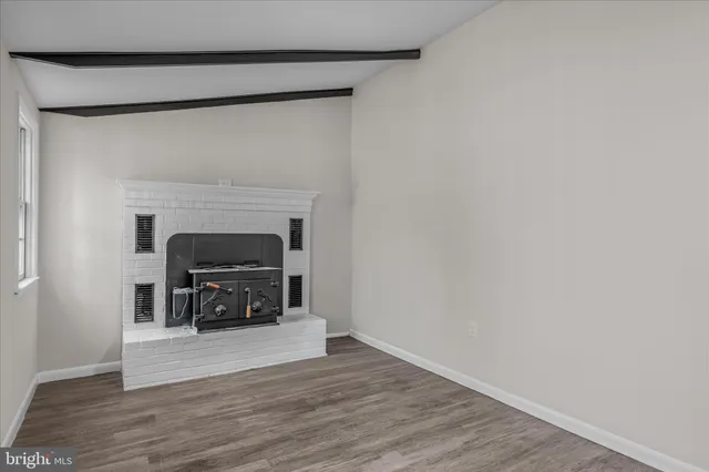a view of livingroom with furniture and a fireplace