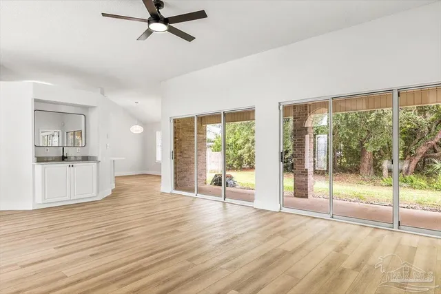 a kitchen with stainless steel appliances a refrigerator and a stove top oven