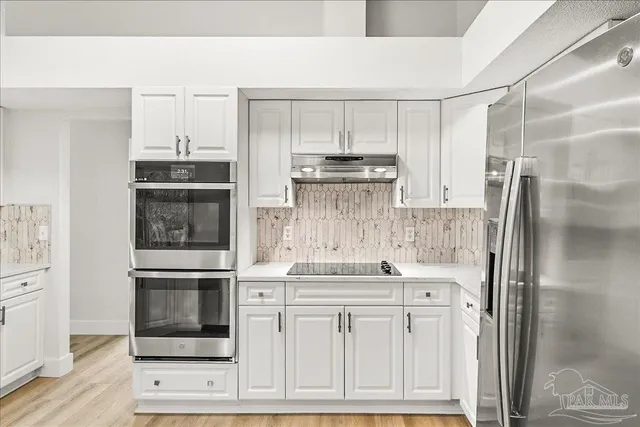 a kitchen with a sink cabinets and window