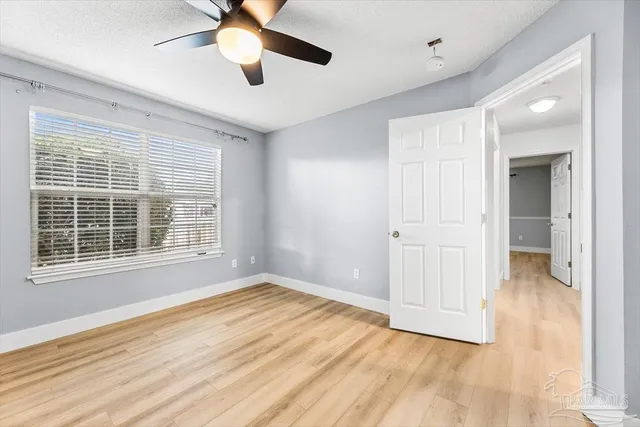 a bathroom with a granite countertop toilet a sink and bathtub